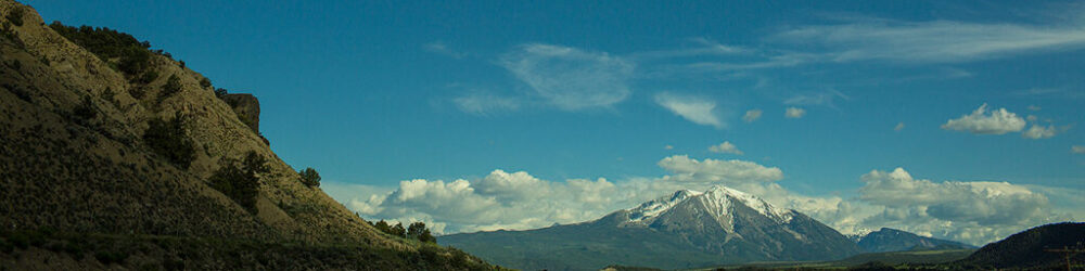 A scenic view of Colorado mountains during the day